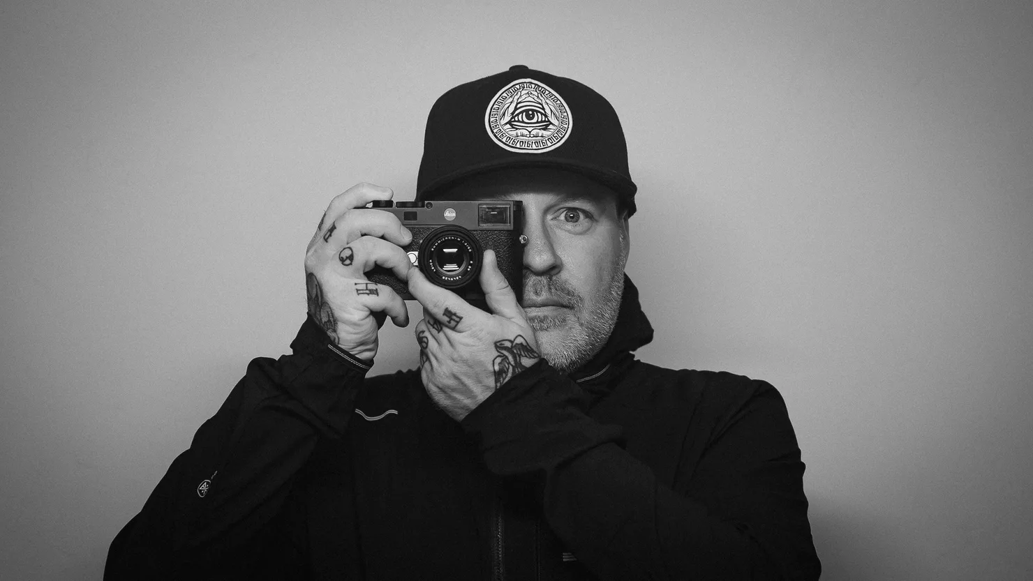Kevin Korpi with a Leica to his eye